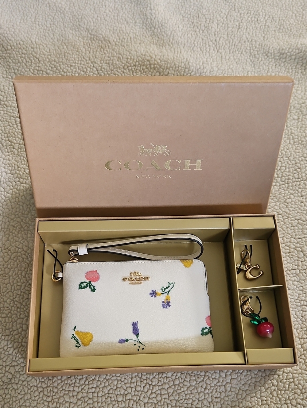 Coach White Floral Wristlet Pouch with Gold Charm Accents